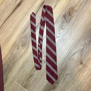 Resilio tie. Dark red, striped with white and blue ￼